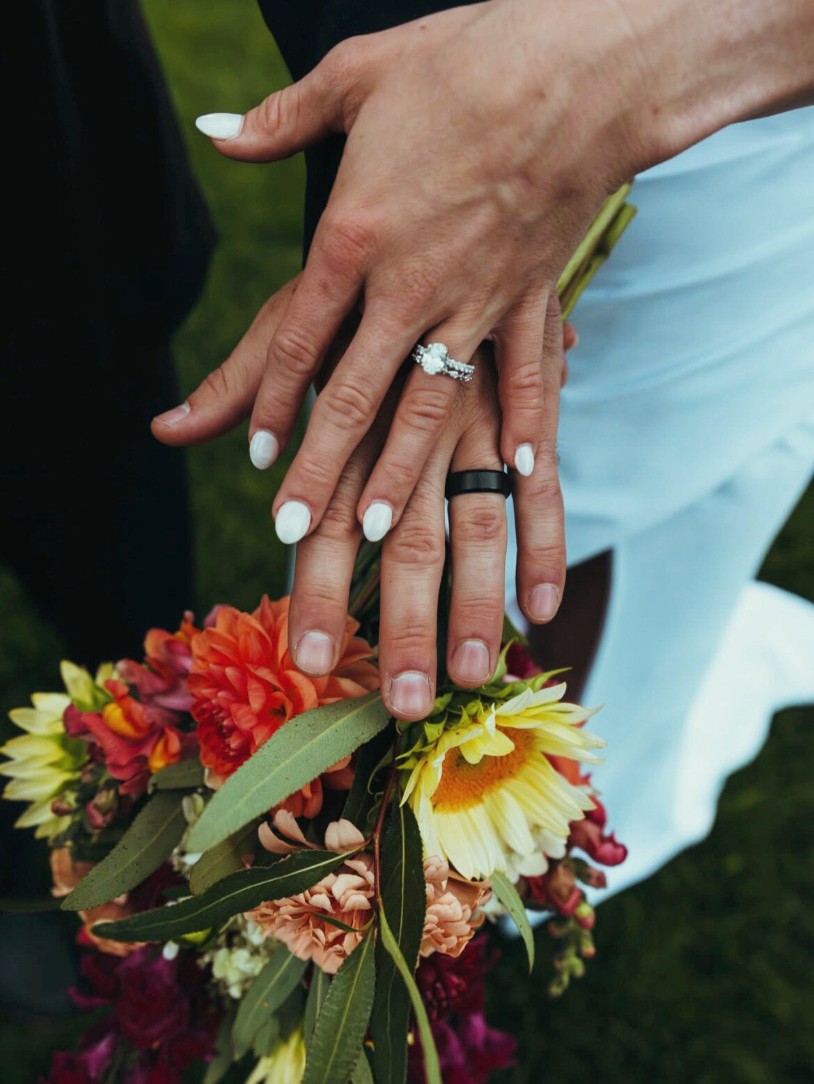 Seasonal wedding bouquet with wedding rings